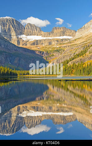 Early Morning Fall Reflections on Lake Josephine in Glacier National Park in Montana Stock Photo