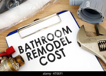 Clipboard with words bathroom remodel cost. Renovation estimate. Stock Photo
