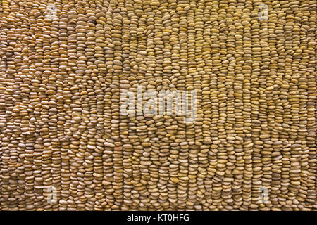 The structure of decorative gravel wall. Stock Photo
