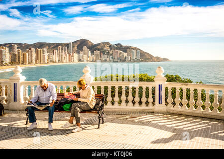 Eldery couple relax sitting on the bench in Mediterranean Balcony in Benidorm, Spain Stock Photo
