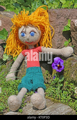 even knitted doll with yellow hair Stock Photo