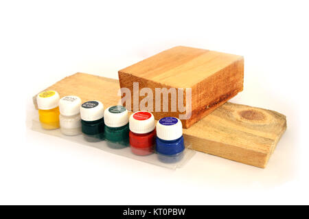 Wood fragments and multi-colored toxic-free wood paints Stock Photo