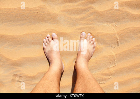 barefoot in sand Stock Photo