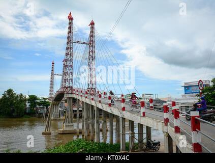 An Giang, Vietnam - Oct 2, 2015. A cable bridge at Chaudoc township in An Giang, Vietnam. An Giang occupies a position in the upper reaches of the Mek Stock Photo