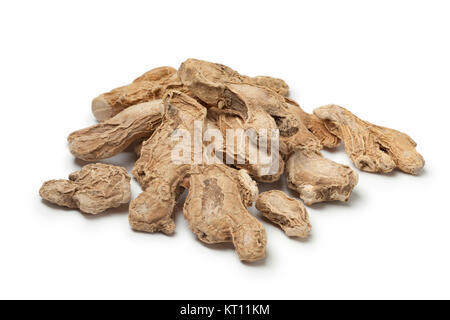 Heap of dried ginger roots  on white background Stock Photo