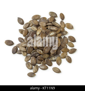 Heap of dried pumpkin seeds  on white background Stock Photo