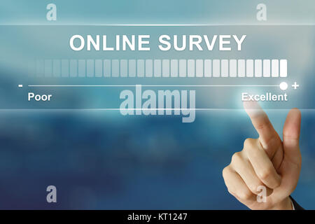 business hand clicking excellent online survey on virtual screen Stock Photo