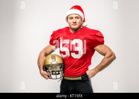 Football player in santa hat Stock Photo