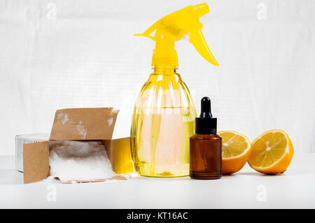 Eco-friendly natural cleaners made of lemon and baking soda on white wooden table Stock Photo