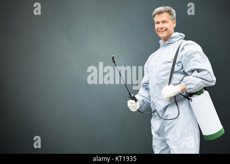 Pest Control Worker In Protective Workwear Stock Photo