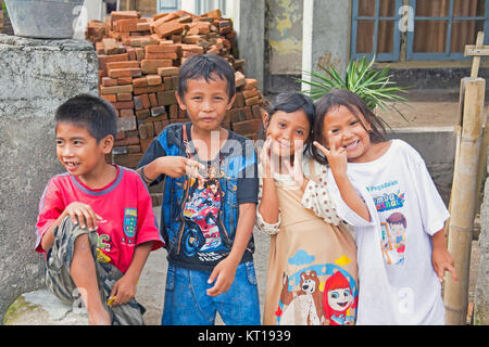 LOMBOK, INDONESIA - DECEMBER 30, 2016: Indonesian kids in the streets in Lombok, Indonesia on the 30th of december 2016 Stock Photo