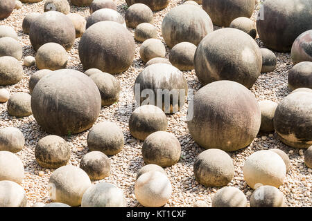 Stone sphere in garden Stock Photo