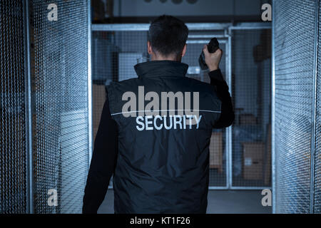Security Guard Standing In The Warehouse Stock Photo