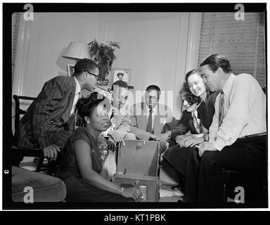 Dizzy Gillespie, Mary Lou Williams, Tadd Dameron, Hank Jones, Milt Orent, Dixie Bailey, and Jack Teagarden, Mary Lou Williams' apartment, New York, N.Y., ca. Aug. 1947 (William P. Gottlieb 09281) Stock Photo