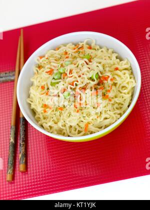 Cooked instant noodles isolated against a white background Stock Photo