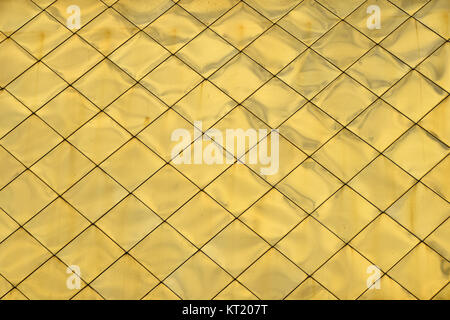 Golden metal roof tile panels texture background Stock Photo