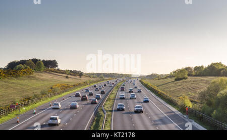 Working, England, UK - April 13, 2014: Traffic travels through farmland in Surrey, south east England, on the A3 motorway. Photograph composed and cro Stock Photo