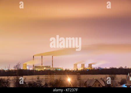 Thermal power plant and cooling towers at night Stock Photo