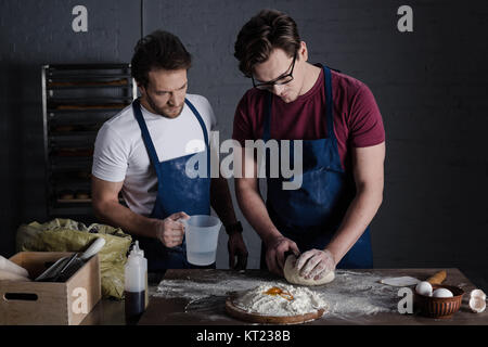 Bakers preparing dough Stock Photo