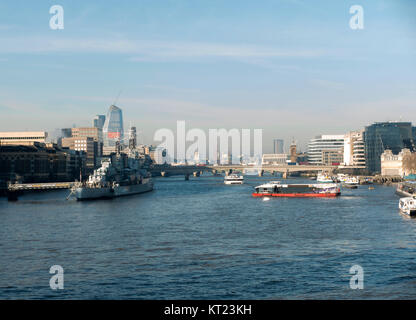 City Cruises Tourist Boat on River Thames from Tower Bridge with HMS Belfast Towards London Bridge London England United Kingdom UK