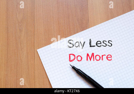 Say less do more concept on notebook Stock Photo