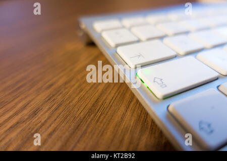 White and Grey Keyboard on Wooden Table Stock Photo