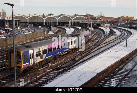 Commuter train in the snow Stock Photo