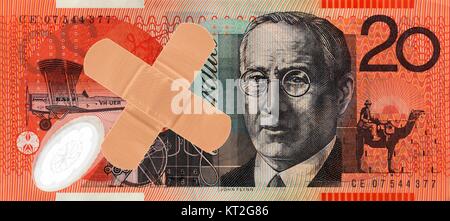 An Australian twenty dollar note and a bandaid Stock Photo