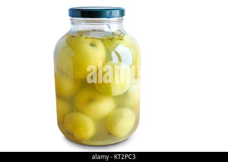 Home canning: in a large glass jar pickled apples. Presented on a white background. Stock Photo