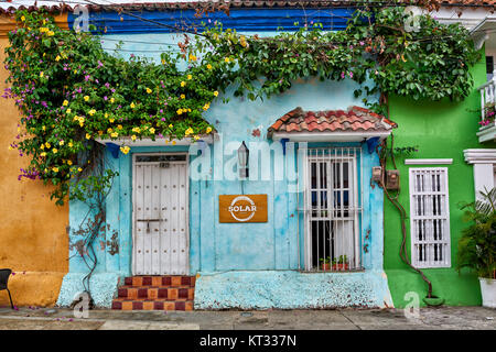 typical colorful facades with flowers of houses in district Getsemani of Cartagena de Indias, Colombia, South America Stock Photo