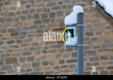 Public footpath walking sign covered in snow. Cotswolds.UK Stock Photo