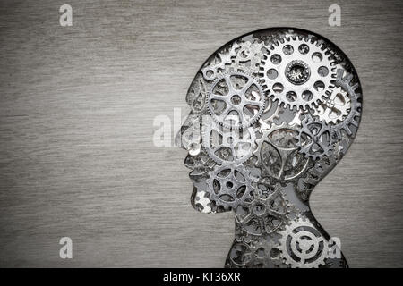 Brain model concept made from gears and cogwheels in wooden plate Stock Photo