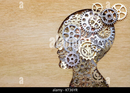 Brain model concept made from gears and cogwheels in wooden plate Stock Photo