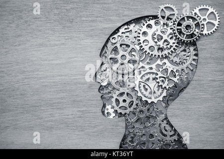 Brain model concept made from gears and cogwheels in wooden plate Stock Photo
