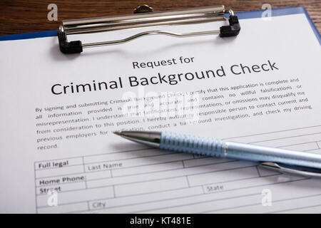 Criminal Background Check Application Form With Pen Stock Photo