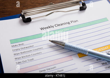 Close-up Of Weekly Cleaning Plan Form Stock Photo