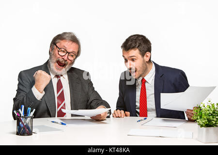 The two colleagues working together at office on white background. Stock Photo