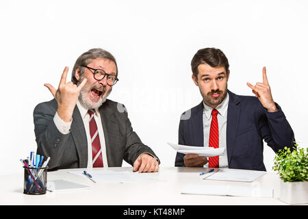 The two colleagues working together at office on white background. Stock Photo