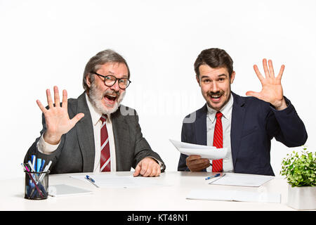 The two colleagues working together at office on white background. Stock Photo