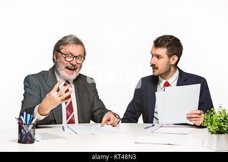 The two colleagues working together at office on white background. Stock Photo