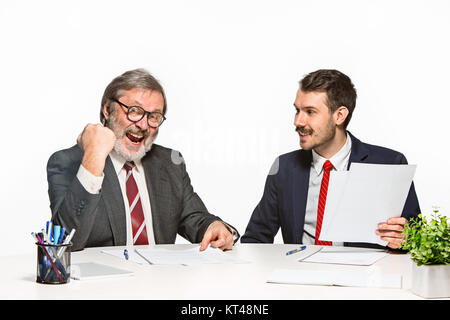 The two colleagues working together at office on white background. Stock Photo