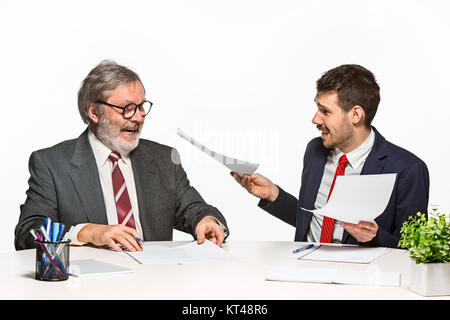 The two colleagues working together at office on white background. Stock Photo