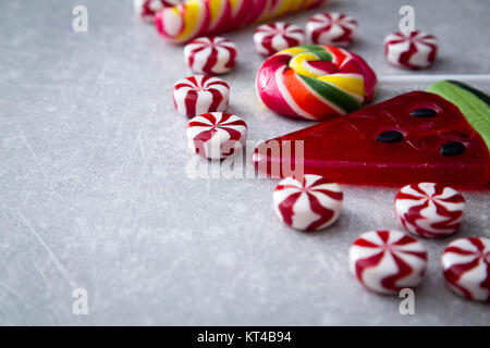 Colorful candies on stone background. Top view with copy space Stock Photo