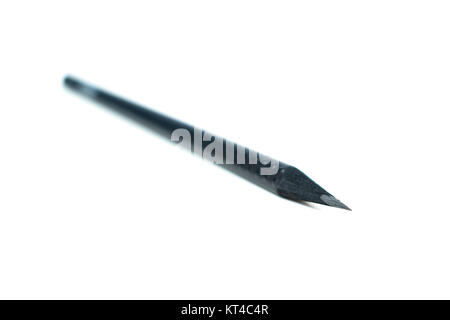 Black sharp wooden pencil on white background. Writer's tool, accessory Stock Photo