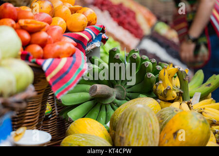 A lot of tropical fruits in outdoor market Stock Photo