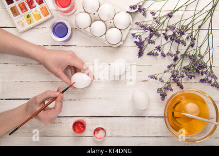 hands coloring egg Stock Photo