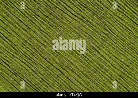 Light green crinkled fabric background texture Stock Photo