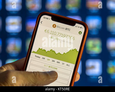 NEW YORK, USA - NOVEMBER 7, 2017: Crypto currency app with graph of value development and buy bitcion option Stock Photo