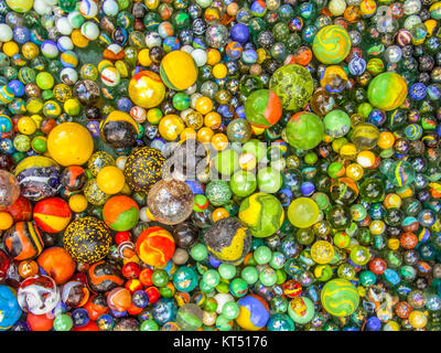 Glass marbles of different sizes in a color pattern Stock Photo