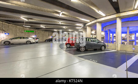 Cars in Modern Underground circular parking garage Stock Photo